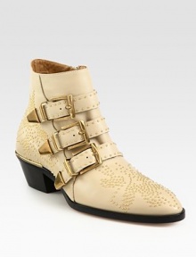 Metal studs coat this leather ankle boot for a tough-luxe effect, finished with adjustable buckle straps and a stacked heel. Stacked heel, 2 (50mm)Leather upper with metal studsSide zip and adjustable buckle strapsLeather lining and solePadded insoleMade in Italy Metal studs coat this leather ankle boot for a tough-luxe effect, finished with adjustable buckle straps and a stacked heel. Stacked heel, 2 (50mm)Leather upper with metal studsSide zip and adjustable buckle strapsLeather lining and solePadded insoleMade in Italy
