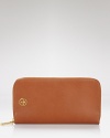 With space for all the everyday essentials, Tory Burch's brown leather zip-around wallet is indispensably chic.