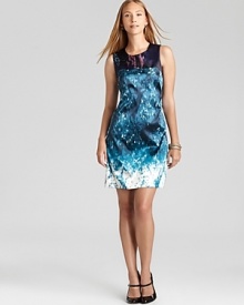 An abstract graphic print emboldens this T Tahari sheath dress, accented with a contrast neckline for trend-right pattern mixing. An abstract graphic print emboldens this T Tahari sheath dress, accented with a contrast neckline for trend-right pattern mixing.