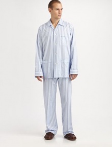 A luxurious cotton two-piece set, soft enough to lounge around in all night and day. Machine wash. Imported.SHIRTButtonfrontSpread collarChest, waist patch pocketsPANTSFlat-front styleAdjustable two-button waistSide elastic waist insetsNo flyInseam, about 31