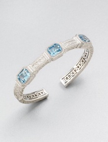 A highly intricate design with three emerald-cut blue topaz stones. Blue topazRhodium-plated sterling silverDiameter, about 2.25Slip-on styleImported A highly intricate design with three emerald-cut blue topaz stones. Blue topazRhodium-plated sterling silverDiameter, about 2.25Slip-on styleImported