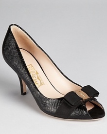 Slick and shining, these sleek pumps are the epitome of Italian-style chic. A grosgrain bow, finished with a Salvatore Ferragamo logo plate, wraps the peeptoe. Slick and shining, these sleek pumps are the epitome of Italian-style chic. A grosgrain bow, finished with a Salvatore Ferragamo logo plate, wraps the peeptoe.