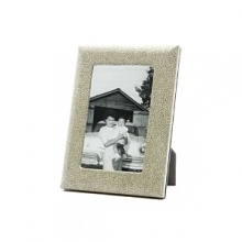 Supple shagreen-embossed fine Italian leather wraps this handcrafted frame in true luxury. A sturdy easel and easy access to photos makes it equal parts form and function. Supple shagreen-embossed fine Italian leather wraps this handcrafted frame in true luxury. A sturdy easel and easy access to photos makes it equal parts form and function.