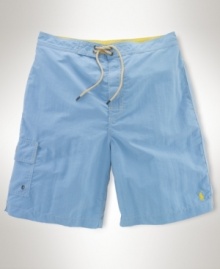 A quick-drying swim short is designed for a classic fit in a preppy plaid print for an authentic look. A quick-drying swim short is designed for a classic fit in a preppy plaid print for an authentic look.