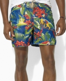 A classic-fitting swim trunk is designed in super-soft, quick-dry microfiber with a tropical parrot print for the ultimate beach-ready style. A classic-fitting swim trunk is designed in super-soft, quick-dry microfiber with a tropical parrot print for the ultimate beach-ready style.