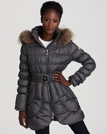 A tulip hem and waist-cinching belt lend feminine charm to this Dawn Levy down coat, finished with a sumptuous fur-trimmed hood for extra protection from cool winds. A tulip hem and waist-cinching belt lend feminine charm to this Dawn Levy down coat, finished with a sumptuous fur-trimmed hood for extra protection from cool winds.