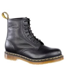 This pair of men's boots is pure Dr. Martens--funky modern boots for men crafted in quality leather, with their signature yellow topstitching and logo tag at heel. Imported. This pair of men's boots is pure Dr. Martens--funky modern boots for men crafted in quality leather, with their signature yellow topstitching and logo tag at heel. Imported.
