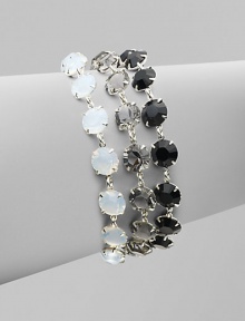 Three strands of shimmering Swarovski crystals in jet, opal and smoke shades, richly faceted in polished prong settings.CrystalSilverplatedLength, about 6¾Width, about 1Lobster claspMade in Italy Three strands of shimmering Swarovski crystals in jet, opal and smoke shades, richly faceted in polished prong settings.CrystalSilverplatedLength, about 6¾Width, about 1Lobster claspMade in Italy