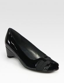 Glassy patent leather go-to fronted by lavish grosgrain ribbon trim. Self-covered heel, (25mm)Patent leather and grosgrain ribbon upperLeather liningExclusive rubber solePadded insoleImported Glassy patent leather go-to fronted by lavish grosgrain ribbon trim. Self-covered heel, (25mm)Patent leather and grosgrain ribbon upperLeather liningExclusive rubber solePadded insoleImported