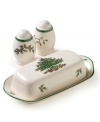 A covered butter dish and salt and pepper shakers featuring Spode's beloved Christmas Tree pattern. The butter dish boasts the signature full evergreen tree impeccably decorated with baubles and tinsel, with gifts placed underneath. The shakers are enlivened with sprigs of holly and ivy. Butter dish measures 8 in length.