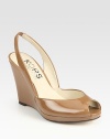 Comfortable slingback and uplifting wedge adorn this lovely patent leather design. Self-covered wedge, 3½ (90mm) Covered platform, ¼ (5mm) Compares to a 3¼ heel (80mm) Patent leather upper Leather lining and sole Padded insole Made in Italy