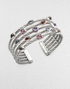 From the Confetti Collection. Five twisted sterling silver cables, scattered with a colorful array of faceted gemstones, in a fabulous open cuff design. Garnet, iolite, rhodalite garnet, pink tourmaline and amethyst Sterling silver Diameter, about 2½ Width, about 1 Imported