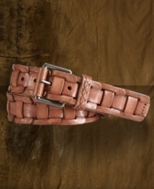 A supple leather strap is intricately woven through distressed leather links to create an edgy belt with a rugged textural element. A supple leather strap is intricately woven through distressed leather links to create an edgy belt with a rugged textural element.