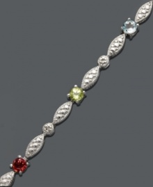 Dress it up with sparkle and shine. This unique tennis bracelet by Victoria Townsend features bursts of round-cut garnet (1/8 ct. t.w.), peridot (1/8 ct. t.w.), amethyst (1/10 ct. t.w.), blue topaz (1/10 ct. t.w.) and citrine (1/10 ct t.w.). Crafted in sterling silver. Approximate length: 7 inches. Dress it up with sparkle and shine. This unique tennis bracelet by Victoria Townsend features bursts of round-cut garnet (1/8 ct. t.w.), peridot (1/8 ct. t.w.), amethyst (1/10 ct. t.w.), blue topaz (1/10 ct. t.w.) and citrine (1/10 ct t.w.). Crafted in sterling silver. Approximate length: 7 inches.