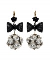 Bring a little Studio 54 flavor to the table with chic disco ball-inspired earrings.  Flashy crystal fireballs dangle from bold, black ribbon and flower drops. Betsey Johnson earrings crafted in antique gold tone mixed metal. Approximate drop: 1-1/2 inches.