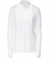 Elegant, feminine top made of fine, white viscose - Features a small collar, wide pleated front, and colored button on the collar - Pleasant waisted length, slim, fitted cut - Pair with slim pants or pencil skirt for a polished office look