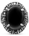 Punctuate your look. This bold, oval-shaped ring highlights a black onyx gemstone (4-3/4 ct. t.w.) surrounded by glittering marcasite (1/4 ct. t.w.) in sterling silver. Size 7.