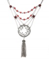 Up-to-the-minute and unique. A tassel embellishment makes Lucky Brand's necklace trendy, while its layered chains and leaf medallion add distinctive detailing. Adorned with semiprecious ruby-hued jade and colored crystals, it's crafted in silver tone mixed metal. Approximate length: 18 inches + 2-inch extender. Approximate drop: 6-1/4 inches.