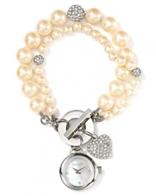 Carolee proves practicality can be pretty with this double strand pearl watch. With crystal beads and a delicate watch charm, it's a piece you'll wear now and treasure forever. Carolee proves practicality can be pretty with this double strand pearl watch. With crystal beads and a delicate watch charm, it's a piece you'll wear now and treasure forever.