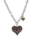 Become one with the animal kingdom. This wild style by GUESS features a leopard print heart pendant with black enamel and crystal accents. Crafted in gold tone mixed metal. Approximate length: 16 inches. Approximate drop: 1-1/2 inches.