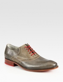 Burnished leather and contrast lacing overtake this classic saddle shoe lending endless style possibilities.Leather upperLeather liningPadded insoleRubber soleImported Burnished leather and contrast lacing overtake this classic saddle shoe lending endless style possibilities.Leather upperLeather liningPadded insoleRubber soleImported