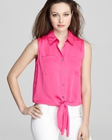 Whether you choose to layer it or wear it on its own, the satin finish and color-charged hue of this VINCE CAMUTO blouse is bound to captivate. Whether you choose to layer it or wear it on its own, the satin finish and color-charged hue of this VINCE CAMUTO blouse is bound to captivate.
