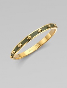 Richly dimensional skulls, gleaming and slightly ghoulish, line up around a graceful golden bangle layered in colorful enamel.EnamelGoldtoneDiameter, about 2½Imported Richly dimensional skulls, gleaming and slightly ghoulish, line up around a graceful golden bangle layered in colorful enamel.EnamelGoldtoneDiameter, about 2½Imported