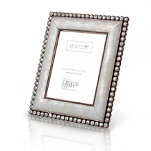Evoking classic Hollywood glamour, this boudoir frame is meticulously handcrafted of precious mother of pearl and genuine Swarovski crystals with a unique color tone. Fully detailed floral back uses metal and enamel and also features more handset crystals. Evoking classic Hollywood glamour, this boudoir frame is meticulously handcrafted of precious mother of pearl and genuine Swarovski crystals with a unique color tone. Fully detailed floral back uses metal and enamel and also features more handset crystals.