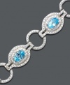 Icy ovals and glittering gemstones link up for a dazzling effect. Bracelet crafted in sterling silver features oval-cut blue topaz (4-3/4 ct. t.w.) and diamond accents. Approximate length: 7 inches.