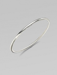 From the Bangle Collection. A single bangle of sterling silver, smooth on the outside and cabled on the inside, to wear alone or with others. Sterling silver Width, about ¼ Diameter, about 2½ Imported From the Bangle Collection. A single bangle of sterling silver, smooth on the outside and cabled on the inside, to wear alone or with others. Sterling silver Width, about ¼ Diameter, about 2½ Imported