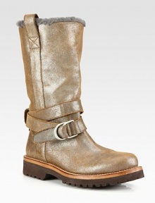Cold weather essential made of glitter-coated leather with shearling lining and a wrap-around ankle strap. Rubber heel, 1½ (40mm)Rubber platform, ¾ (20mm)Compares to a ¾ heel, (20mm)Shaft, 10¾Leg circumference, 14Glitter-coated leather upperSide pull-tabs and adjustable ankle strapShearling linedRubber trek solePadded insoleMade in Italy Cold weather essential made of glitter-coated leather with shearling lining and a wrap-around ankle strap. Rubber heel, 1½ (40mm)Rubber platform, ¾ (20mm)Compares to a ¾ heel, (20mm)Shaft, 10¾Leg circumference, 14Glitter-coated leather upperSide pull-tabs and adjustable ankle strapShearling linedRubber trek solePadded insoleMade in Italy