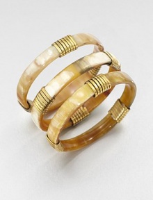 Beautiful recycled horn in two natural tones wrapped in shiny brass, perfect for stacking. Recycled cow hornRecycled brassDiameter, about 2½Slip-on styleImported Please note: Color and design may vary. Beautiful recycled horn in two natural tones wrapped in shiny brass, perfect for stacking. Recycled cow hornRecycled brassDiameter, about 2½Slip-on styleImported Please note: Color and design may vary.