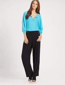 Delicate eyelet trim and applique pleats transform this simple viscose blouse into an elegant wardrobe staple.Tie-front split V necklineGathered three-quarter sleevesEmbellished front yokeStraight hemAbout 25 from shoulder to hem55% viscose/45% rayonDry cleanImportedModel shown is 5'11 (180cm) wearing US size 4. Delicate eyelet trim and applique pleats transform this simple viscose blouse into an elegant wardrobe staple.Tie-front split V necklineGathered three-quarter sleevesEmbellished front yokeStraight hemAbout 25 from shoulder to hem55% viscose/45% rayonDry cleanImportedModel shown is 5'11 (180cm) wearing US size 4.