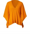 Cozy up to this luxurious top of fine orange cashmere - Irresistibly soft against the skin - Fashionable, relaxed cut is flattering and forgiving - V-neck with wide arms - Casual-classy basic for the workplace or the weekend - Try pairing with a narrow base piece like skinny jeans and leg-lengthening heels
