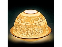 In the world of French art de vivre, Bernardaud is considered the symbol of elite refinement and luxury. A porcelain creation signed by Bernardaud is always appreciated and recognized the world over. Bernardaud artisans use the same technique of hand-sculpting fine, bisque porcelain that was first demonstrated by French artist Paul de Bourgoing in 1828. The glow of a candle shines through the raised and carved surface to contrast light against shadow, revealing a richly detailed design. Bernardaud VotiveLight™ candles add a warm, decorative glow to any room of the home. For a dramatic effect, or to create a festive ambiance, delight your dinner guests by replacing traditional candles with a Bernardaud VotiveLight™. In the world of French art de vivre, Bernardaud is considered the symbol of elite refinement and luxury. A porcelain creation signed by Bernardaud is always appreciated and recognized the world over. Bernardaud artisans use the same technique of hand-sculpting fine, bisque porcelain that was first demonstrated by French artist Paul de Bourgoing in 1828. The glow of a candle shines through the raised and carved surface to contrast light against shadow, revealing a richly detailed design. Bernardaud VotiveLight™ candles add a warm, decorative glow to any room of the home. For a dramatic effect, or to create a festive ambiance, delight your dinner guests by replacing traditional candles with a Bernardaud VotiveLight™.
