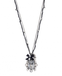 Elegance and flirtation combine. Betsey Johnson pendant highlights a Czech crystal surrounded by glass stones and accented by a ribbon charm. Crafted in silver tone mixed metal. Approximate length: 16 inches + 3-inch extender. Approximate drop: 1-1/2 inches. Elegance and flirtation combine. Betsey Johnson pendant highlights a Czech crystal surrounded by glass stones and accented by a ribbon charm. Crafted in silver tone mixed metal. Approximate length: 16 inches + 3-inch extender. Approximate drop: 1-1/2 inches.