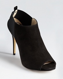 With an elasticized back, these sleek MICHAEL Michael Kors booties easily slip on--making rushing out the door and onto the night's activities ever so effortless. With an elasticized back, these sleek MICHAEL Michael Kors booties easily slip on--making rushing out the door and onto the night's activities ever so effortless.
