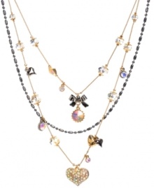 Embrace your inner romantic. Betsey Johnson's flirty style features three rows of whimsical crystals, cherry beads, bows and hearts in clear and pink hues. Chains and setting crafted from gold and hematite tone mixed metal. Approximate length: 16 inches + 3-inch extender. Approximate drop: 3-1/4 inches. Embrace your inner romantic. Betsey Johnson's flirty style features three rows of whimsical crystals, cherry beads, bows and hearts in clear and pink hues. Chains and setting crafted from gold and hematite tone mixed metal. Approximate length: 16 inches + 3-inch extender. Approximate drop: 3-1/4 inches.
