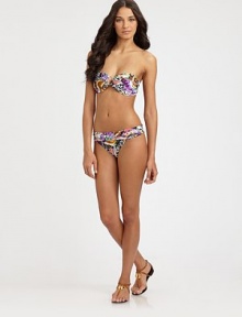 A vivacious design featuring an intoxicating butterfly print, complemented exquisitely by flattering, ruched sides.Fold-over waistbandRuched sidesModerate coverageFully lined85% polyamide/15% spandexHand washImported Please note: Bikini top sold separately. 