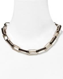 Modern elegance from MARC BY MARC JACOBS: interlocking silver links embellished with sleek black enamel and a bold turnlock closure. Modern elegance from MARC BY MARC JACOBS: interlocking silver links embellished with sleek black enamel and a bold turnlock closure.