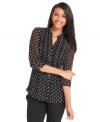 Charter Club's semi-sheer petite blouse features a graphic polka dot print. It's perfect with jeans and a tank top on casual days.
