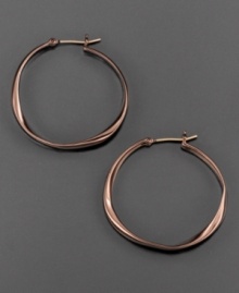 Natural style by Fossil. This hoop earrings are crafted in ion-plated brown mixed metal. Approximate drop: 1-1/4 inches. Natural style by Fossil. This hoop earrings are crafted in ion-plated brown mixed metal. Approximate drop: 1-1/4 inches.