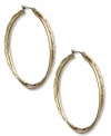 Fashion with a twist. Jones New York's double hoop earrings lend vintage appeal. Crafted of worn gold tone mixed metal. Approximate diameter: 1 inch.