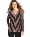 Studio M's newest top looks stunning with a chevron-style stripe--pair with slim black pants to accentuate the pattern.