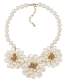 Beautiful blooms. Three large flowers made of shimmery glass stones adorn this stunning statement necklace from Carolee. Crafted in gold tone mixed metal. Approximate length: 16 inches + 2-inch extender. Beautiful blooms. Three large flowers made of shimmery glass stones adorn this stunning statement necklace from Carolee. Crafted in gold tone mixed metal. Approximate length: 16 inches + 2-inch extender.
