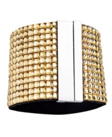 Gold rush. Gorgeous golden-hued Colorado glass accents adorn this chic cuff bracelet from Catherine Stein. Made in silver tone mixed metal, it adds instant drama to any look. Includes a magnetic closure. Approximate length: 7-3/8 inches. Gold rush. Gorgeous golden-hued Colorado glass accents adorn this chic cuff bracelet from Catherine Stein. Made in silver tone mixed metal, it adds instant drama to any look. Includes a magnetic closure. Approximate length: 7-3/8 inches.