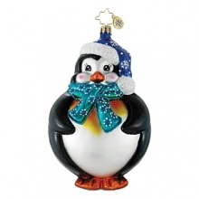 A charming puffin bundled up for frosty weather in a snowflake-print hat and scarf. A charming puffin bundled up for frosty weather in a snowflake-print hat and scarf.