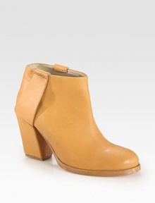 Western-inspired, low-cut design of supple leather with a chunky heel and mock stirrups. Stacked, self-covered heel, 3¾ (95mm)Leather upperPull-on styleLeather lining and solePadded insoleImported Western-inspired, low-cut design of supple leather with a chunky heel and mock stirrups. Stacked, self-covered heel, 3¾ (95mm)Leather upperPull-on styleLeather lining and solePadded insoleImported