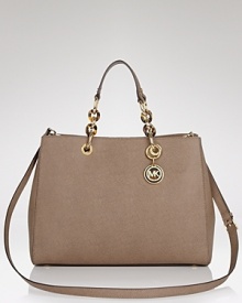 Practical and undeniable luxurious, this satchel from MICHAEL Michael Kors is the ultimate daytime bag. Crafted from leather with a versatile shoulder strap, it's ideal for work or for weekends. Practical and undeniable luxurious, this satchel from MICHAEL Michael Kors is the ultimate daytime bag. Crafted from leather with a versatile shoulder strap, it's ideal for work or for weekends.