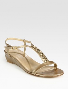 Patent leather demi-wedge design wrapped in glimmering goldtone chains. Self-covered wedge, 1 (25mm)Patent leather upperLeather lining and solePadded insoleImported Patent leather demi-wedge design wrapped in glimmering goldtone chains. Self-covered wedge, 1 (25mm)Patent leather upperLeather lining and solePadded insoleImported